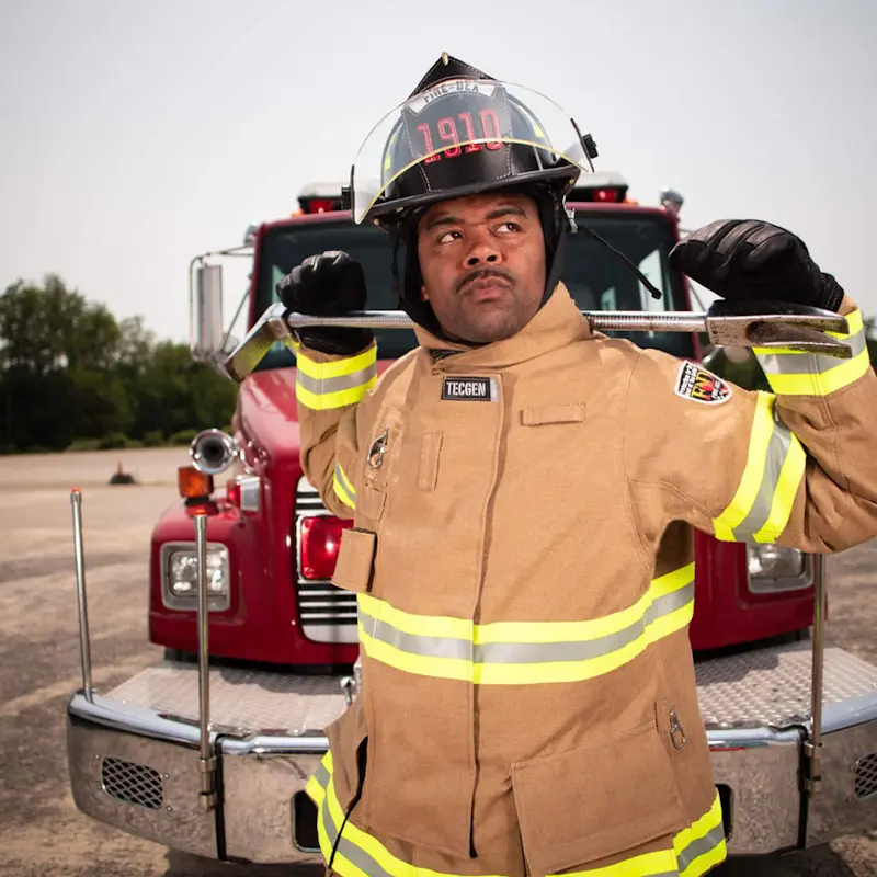 Firefighter wearing Fire-Dex® FXR Custom turnout gear, front view, fully equipped for operational safety and mobility.