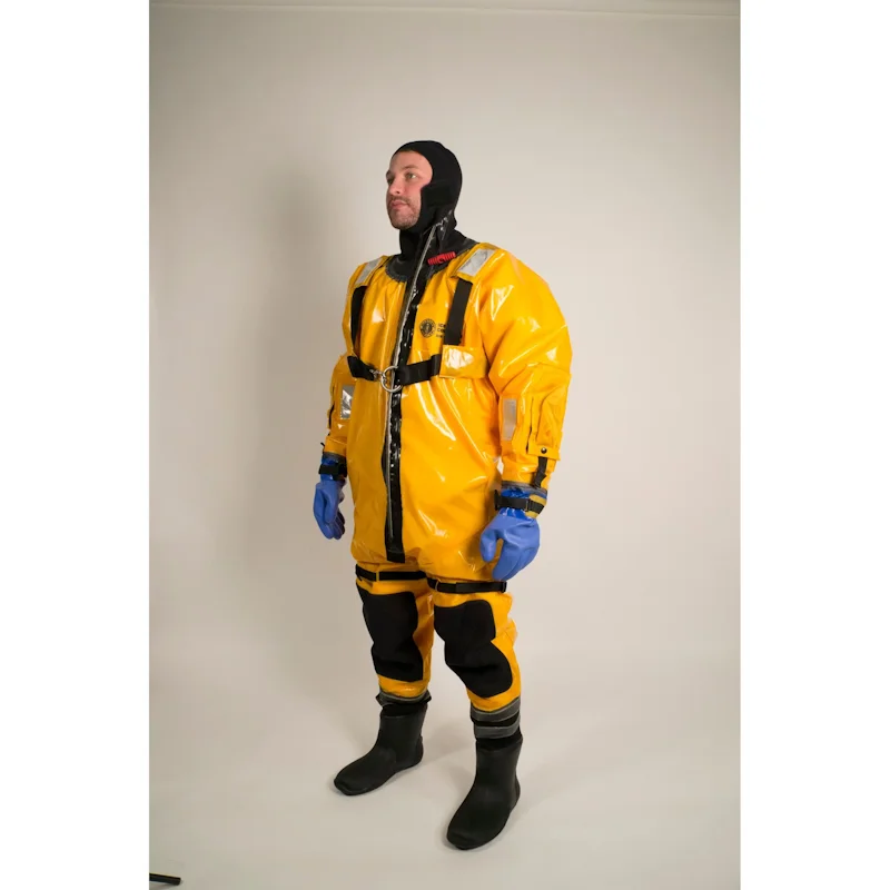 Front left side view of person wearing Mustang Survival® Ice Commander Rescue Suit demonstrating ergonomic design and mobility.