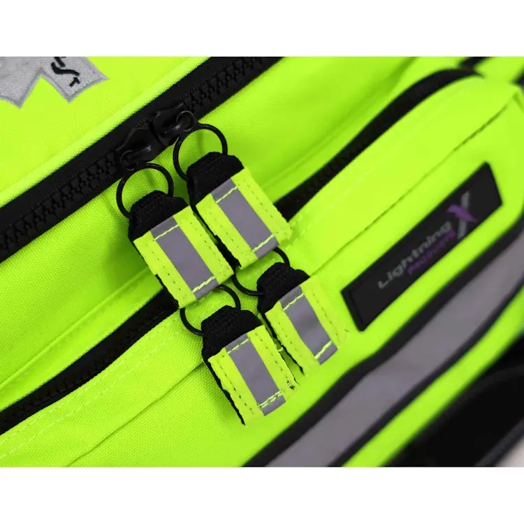 Closeup of Lightning X LXMB25 fluorescent yellow variant showing front top zippers for secure, easy access to emergency medical supplies.