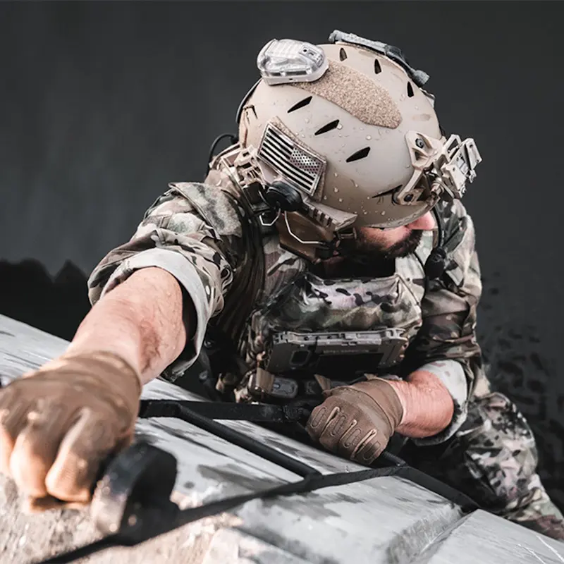 Close-up of a soldier climbing a ladder while wearing the Team Wendy® EXFIL® Carbon Bump Helmet, showing stability, comfort, and mission-ready performance.