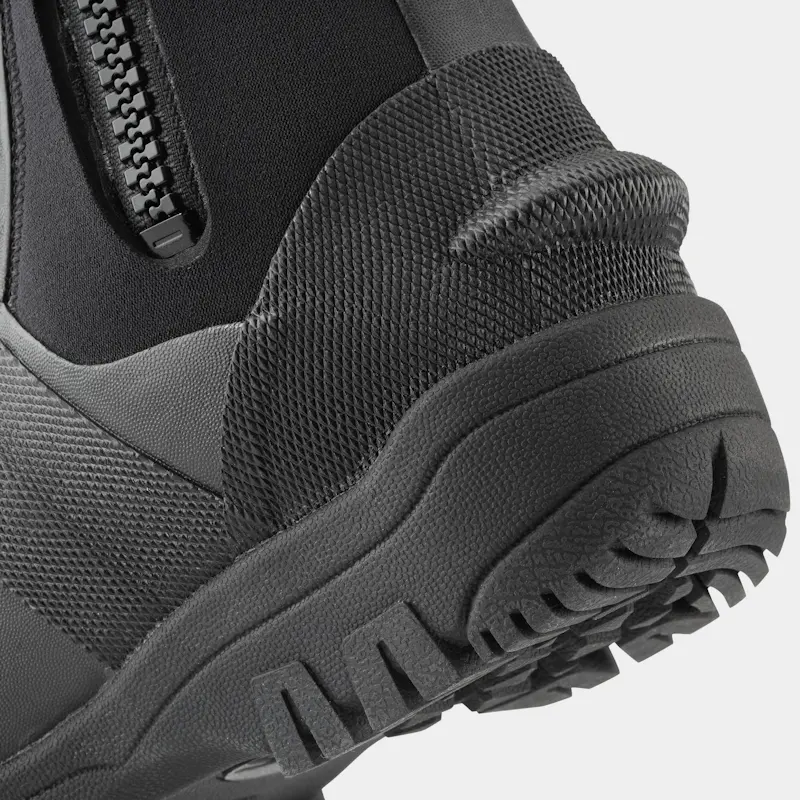 Closeup of a single right-footed NRS Workboot Wetshoe from the back left side, focusing on the reinforced heel and textured sole area.