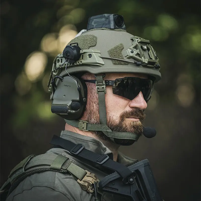 Closeup of a soldier wearing the Team Wendy® EPIC™ Specialist Ballistic Helmet, focusing on facial protection compatibility, chin strap adjustment, and professional field detail.