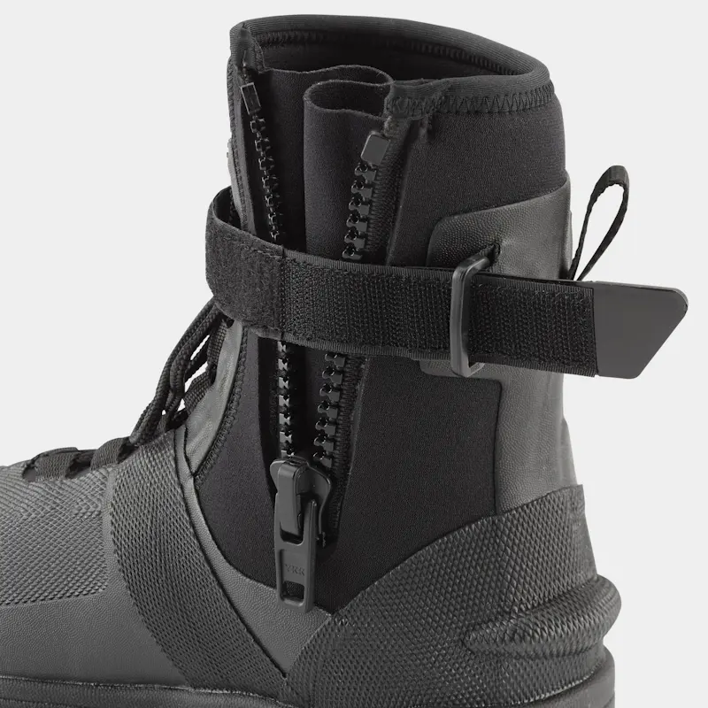 Closeup of a single right-footed NRS Workboot Wetshoe’s left side with the zipper and Velcro strap opened, showing the easy-entry design and secure fit features.