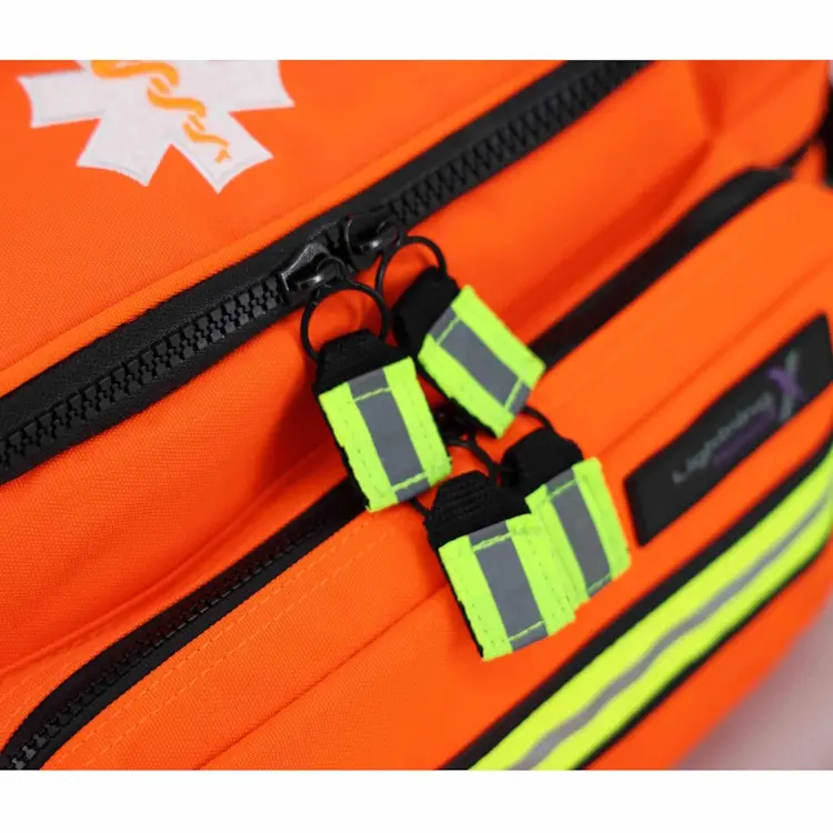 Closeup of Lightning X LXMB25 orange variant showing front top zippers for secure, easy access to emergency medical supplies.