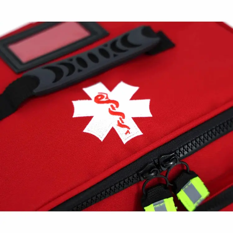 Closeup of Lightning X LXMB25 red variant showing front top section with prominent medical emblem for quick identification in emergencies.
