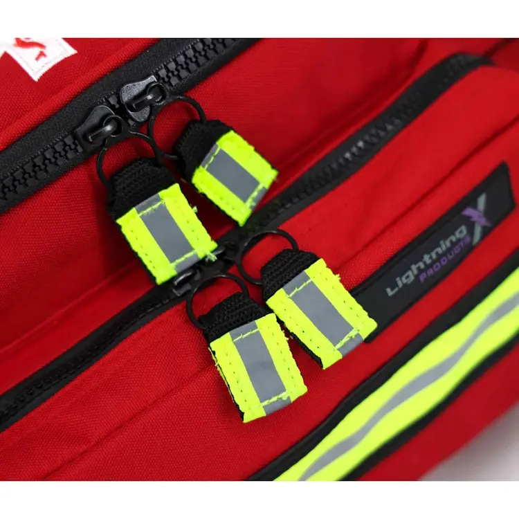 Closeup of Lightning X LXMB25 red variant showing front top zippers for secure, easy access to emergency medical supplies.