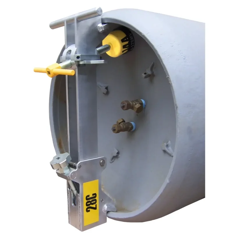 Metal bracket from the Chlorine Institute Cylinder Emergency Kit-B in use on a chlorine cylinder, designed to securely seal connections and prevent leaks during emergency response.