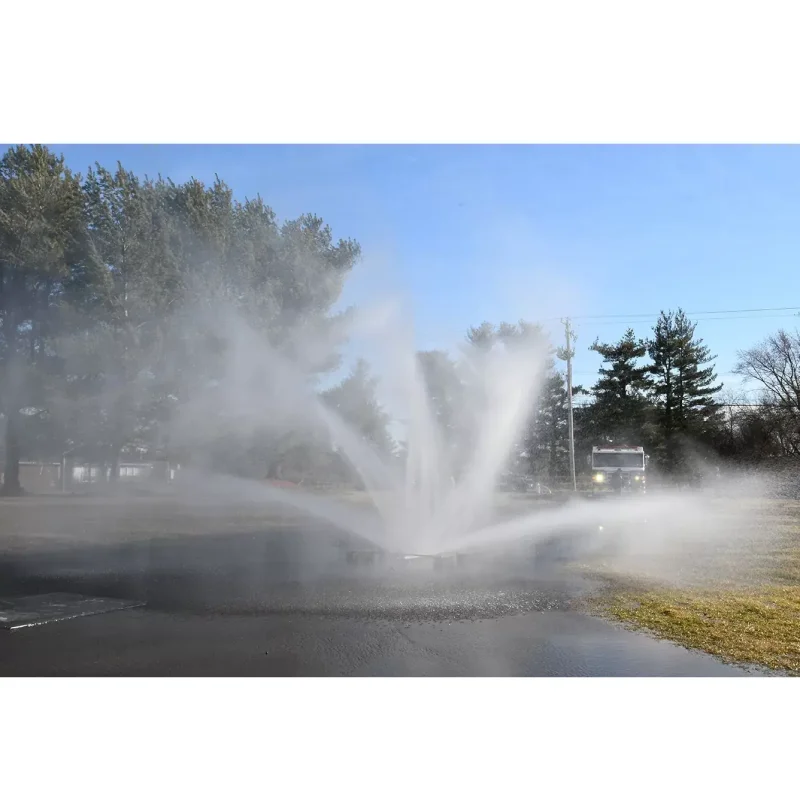 Ziamatic™ Vehicle Cooling Unit in use, spraying a powerful water mist to reduce heat and protect firefighters during emergency operations.