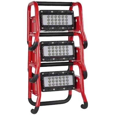 Three red Streamlight® Portable Scene Light II units stacked vertically in their tubular roll-cage frames, each with a black multi-LED panel and padded top handle, shown nested together for compact storage.