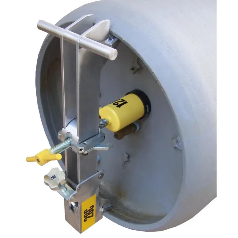 Metal bracket from the Chlorine Institute Cylinder Emergency Kit-B positioned differently on a chlorine cylinder, effectively sealing connections to prevent leaks during emergency situations.