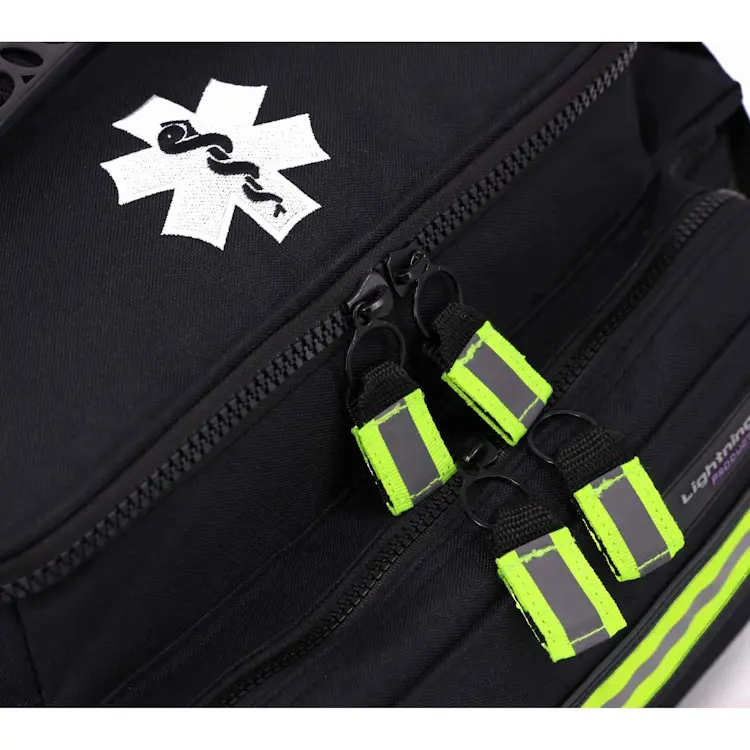 Closeup of Lightning X LXMB25 black variant showing front top section with prominent medical emblem for quick identification in emergencies.
