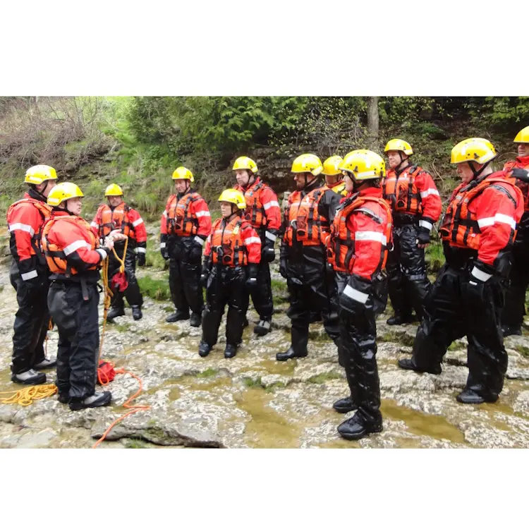 Group of policemen wearing Salus Marine SAR-770 Technician Vests during a coordinated rescue or patrol operation, highlighting uniform safety gear.
