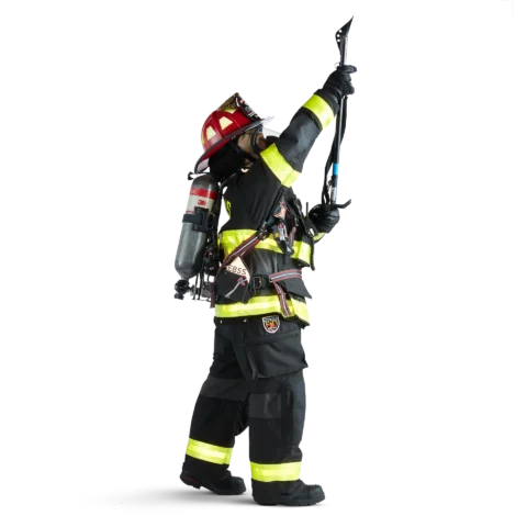 Side view of firefighter wearing black Fire-Dex® AeroFlex™ turnout gear fully equipped with firefighting tools and gear including helmet, gloves, and utility belt.