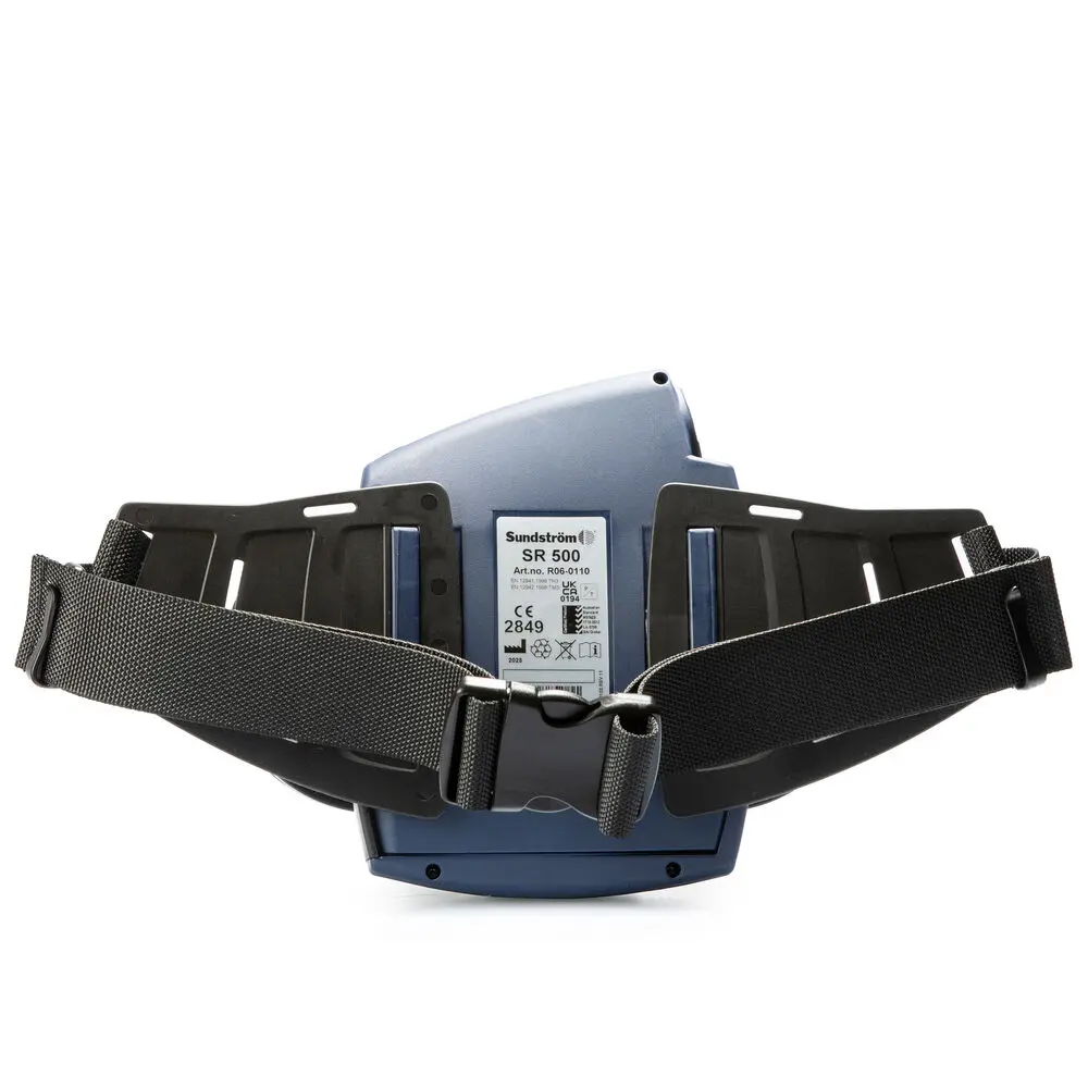 Back view of the Sundström® SR 500 Powered Air-Purifying Respirator, displaying the battery housing, airflow outlet, and harness attachment points for secure and comfortable operation.