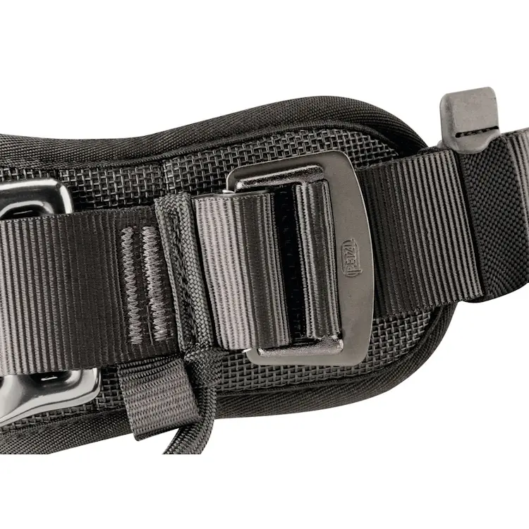 Close-up of the Petzl® AVAO® BOD Harness International Version buckle and strap, highlighting the durable metal buckle and adjustable webbing for a secure and customizable fit.