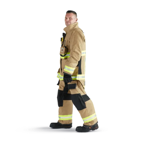 Side view of firefighter wearing tan Fire-Dex® AeroFlex™ turnout gear, featuring breathable materials and ergonomic design for comfort during extended operations.