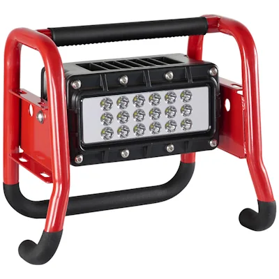 Angled side view of the red Streamlight® Portable Scene Light II with a black 18-LED panel mounted in its tubular roll-cage frame, featuring a padded top carry handle and rubber-tipped feet.