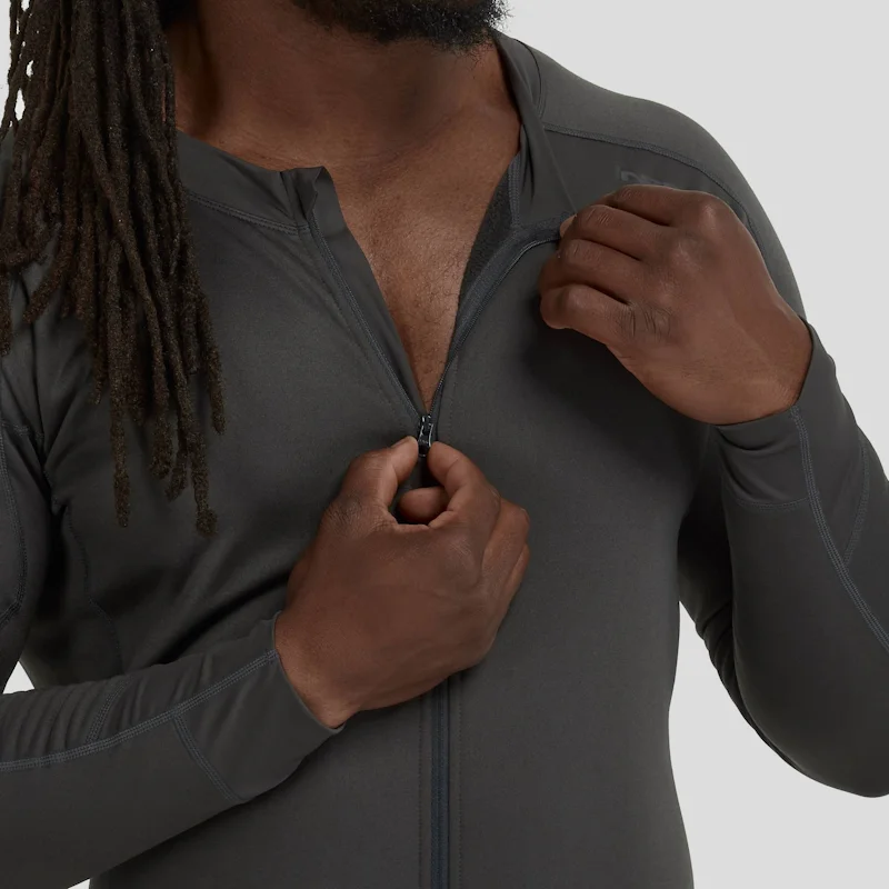 Closeup of a man wearing the NRS Men’s Expedition Weight Union Suit unzipping the chest area, highlighting the durable zipper and fleece-lined interior.