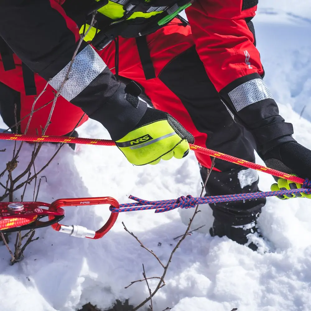 Alternate close-up view of a rescue worker wearing NRS Reactor Rescue Gloves, showing detailed construction and reinforced grip for demanding rescue tasks.