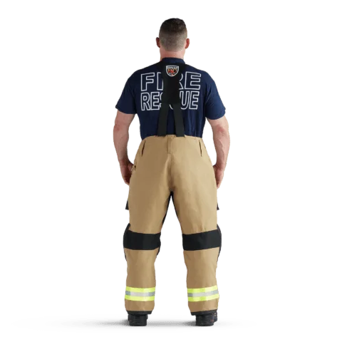 Back view of firefighter wearing tan Fire-Dex® AeroFlex™ turnout gear, showcasing high-visibility reflective markings and flexible fabric for ease of movement.