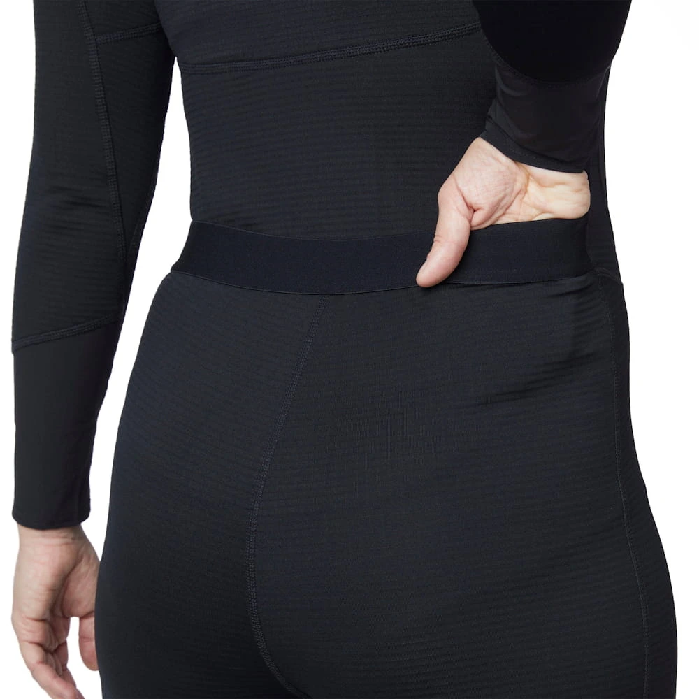 Closeup of back waist area on a woman wearing Mustang Survival® Women’s Kazan Dry Suit Liner featuring flexible fabric and tailored seams for improved fit and movement.