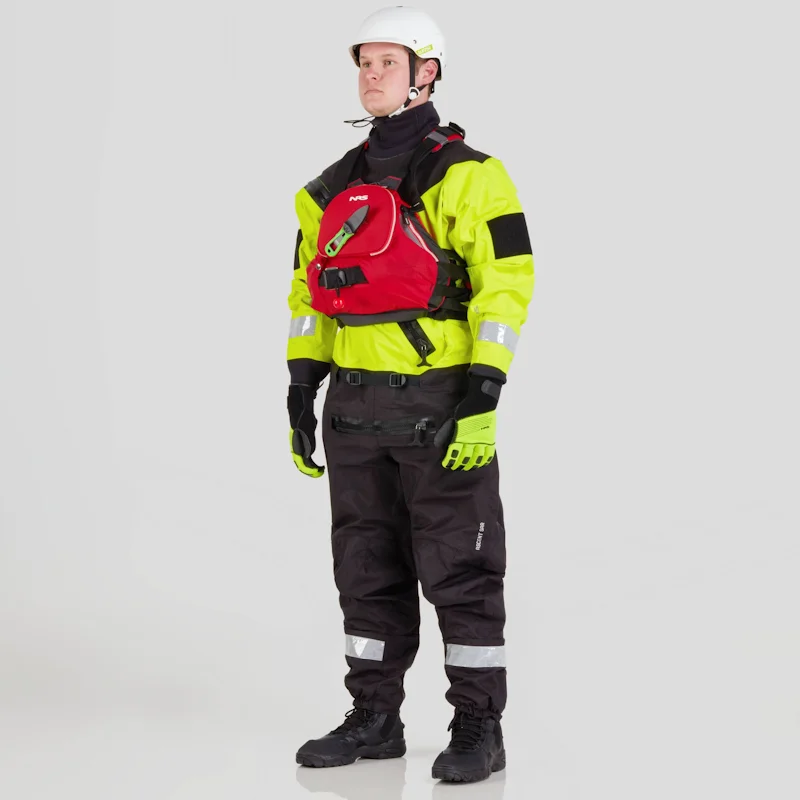 Front side view of a man wearing the NRS Ascent SAR Dry Suit in safety yellow with a red equipment bag secured on the chest, showcasing the suit’s waterproof material and rescue gear setup.