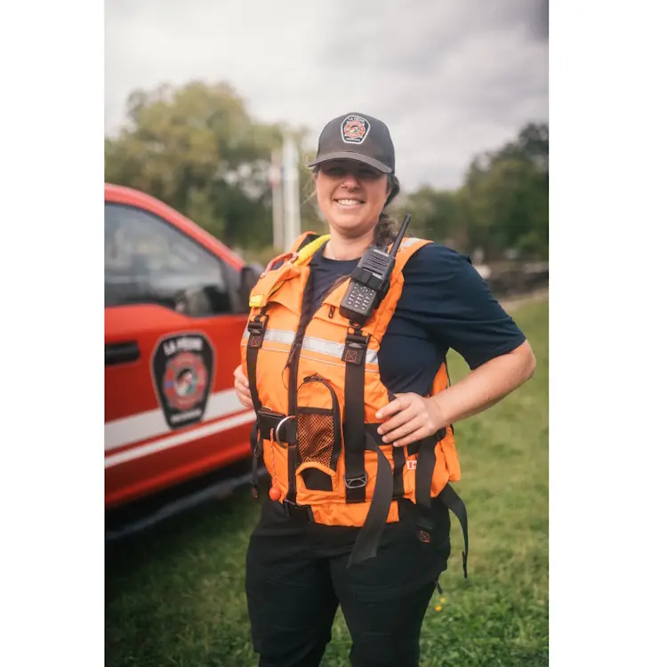 Policewoman wearing Salus Marine SAR-770 Technician Vest, demonstrating a secure and adjustable fit designed for marine rescue and safety operations.