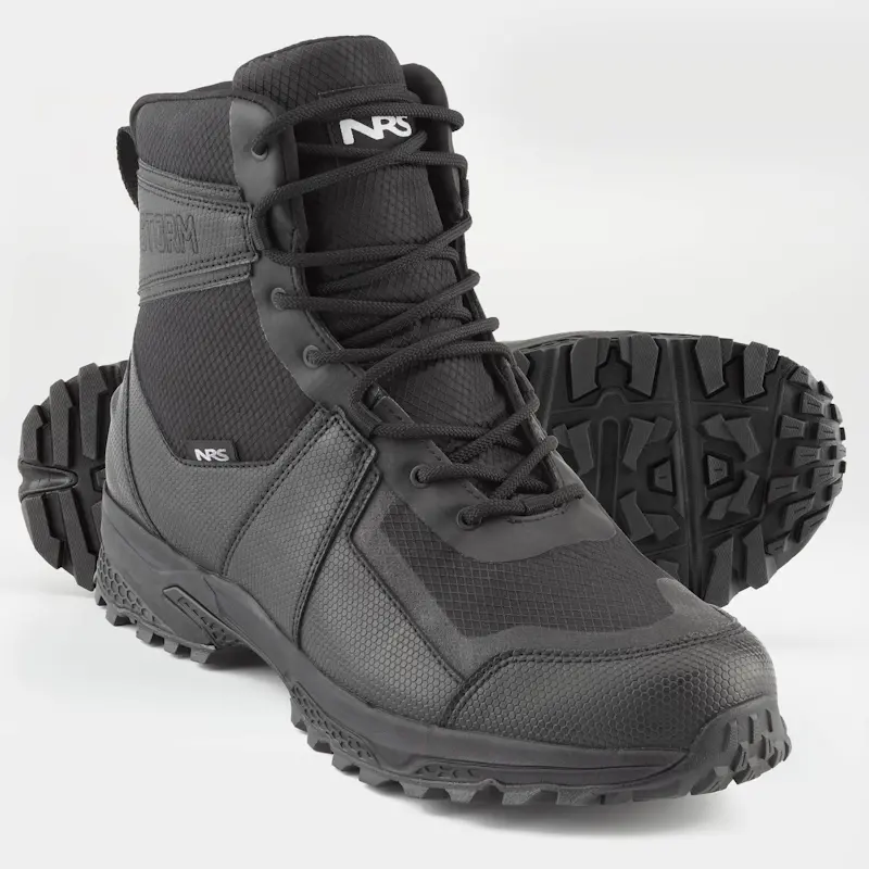 Pair of NRS Storm Boots with one boot standing upright from front right side view and the other laying on its side behind it, showing the textured sole for traction.