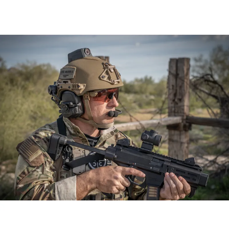 Soldier wearing the Team Wendy® EXFIL® Ballistic SL Helmet outside, demonstrating its lightweight design and seamless integration with tactical and communication gear.