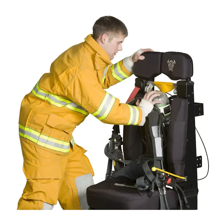 A cylinder being placed onto a Ziamatic™ ROL-LOC Mechanical Bracket mounted on a firetruck seat, demonstrating secure and efficient equipment storage for rapid deployment.