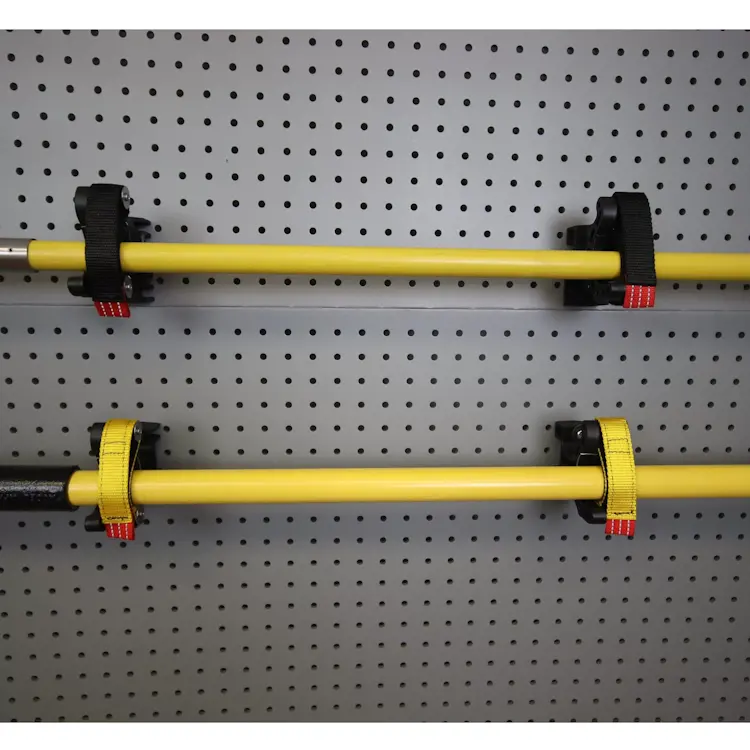 Front view of two pairs of Ziamatic™ SURE-GRIP 275 Tool/Equipment Mounts, each securely holding a piece of firefighting equipment for organized and efficient storage during emergency response.