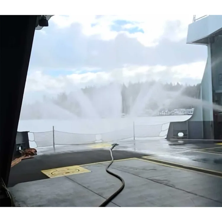 Turtle Fire Systems™ EV Nozzle spraying multiple fans of water mist across a vehicle deck on a ferry.
