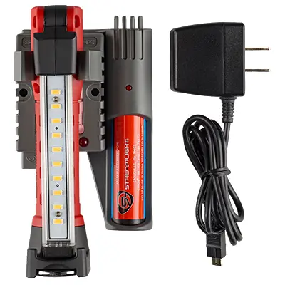 Streamlight® Strion Switchblade® flashlight shown with its charger, highlighting its rechargeable battery system for convenient and reliable power during tactical and emergency use.