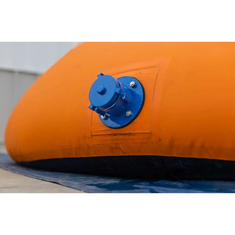 Close-up of the blue flanged outlet fitting on an orange Husky® self-supporting frameless portable water tank.