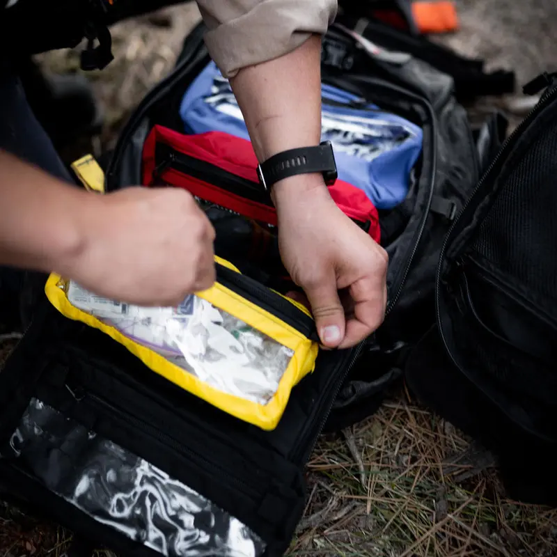 Close-up of the True North Gear Firefly™ Medic Pack opened to reveal organized medical supplies, showcasing its compartmentalized interior designed for fast, efficient access during emergency response.