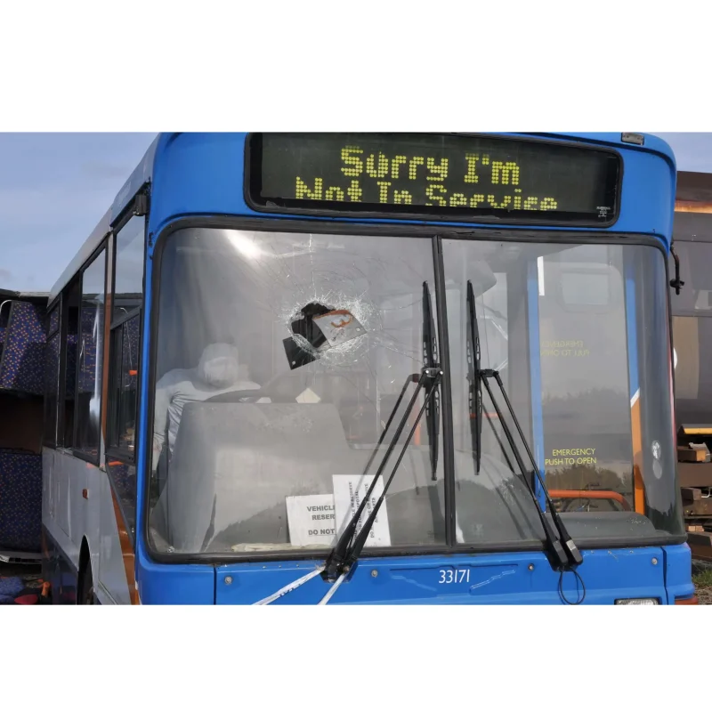 A Ruth Lee™ Multi Trauma Training Manikin with impalement injuries seated in the driver’s seat at the front of a bus, used for advanced vehicle extrication and trauma response training.