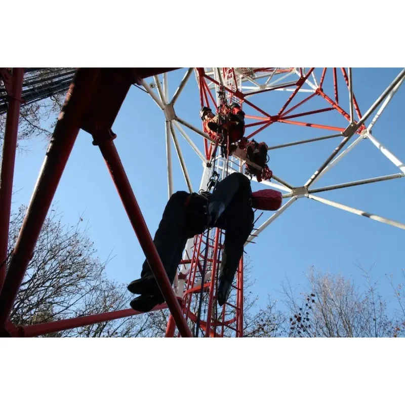 Ruth Lee™ Working at Height Training Manikin being rescued while suspended inside a tower structure, demonstrating advanced rope rescue skills and safety protocols in confined vertical spaces.