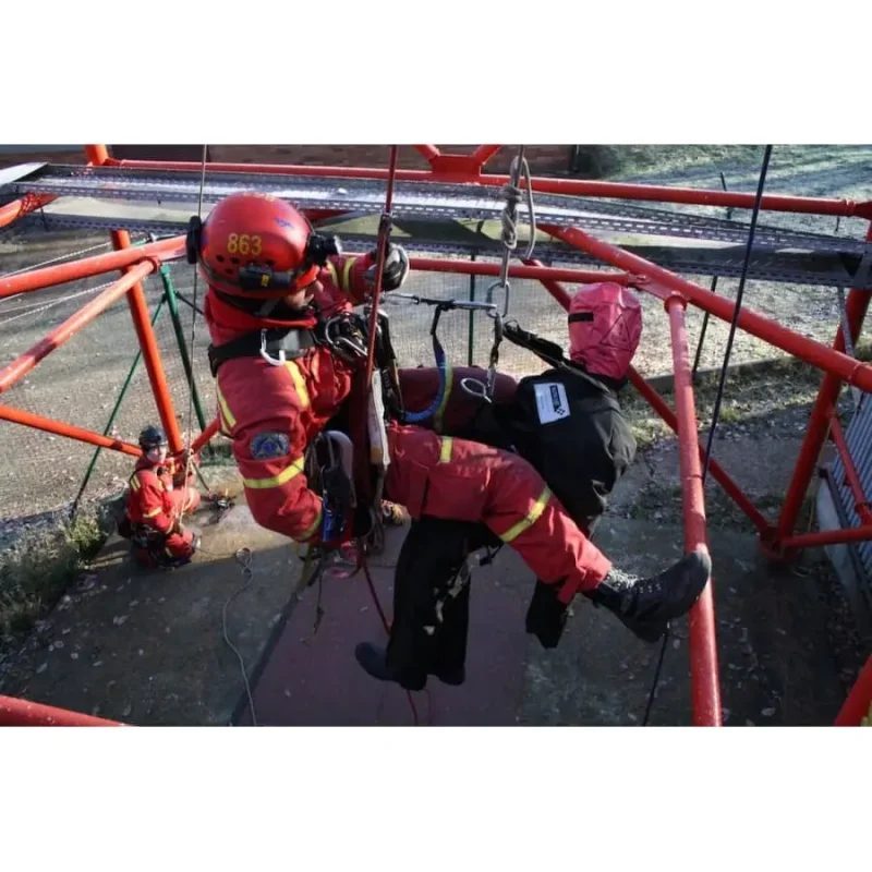 Ruth Lee™ Working at Height Training Manikin suspended in the air alongside a rescuer, demonstrating coordinated aerial rescue techniques and teamwork in high-angle training scenarios.