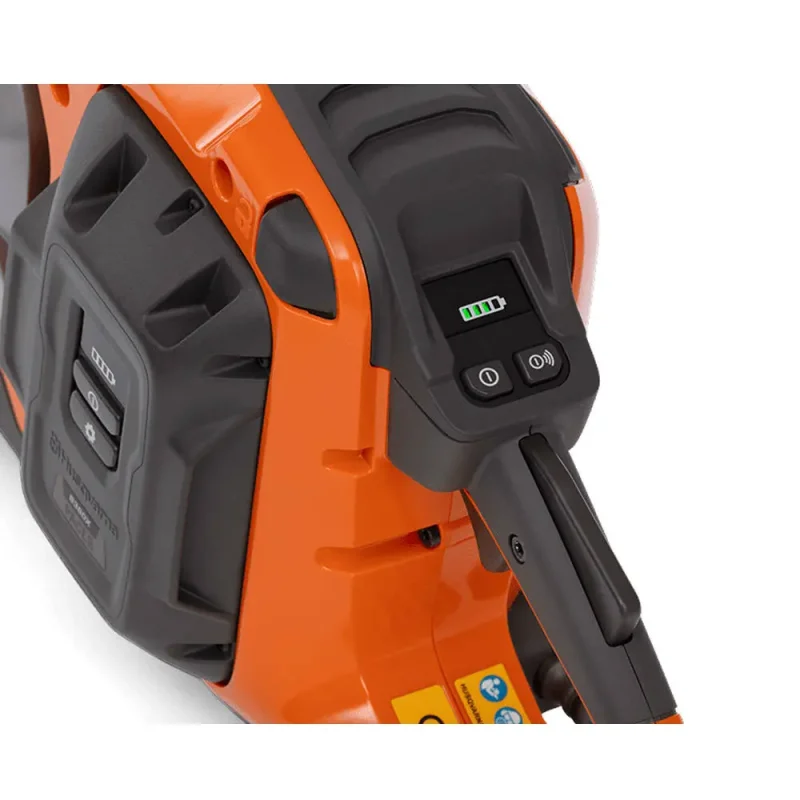 Close-up of handle and control buttons on Tempest VENTMASTER® K1 PACE Fire Rescue Cutoff Saw, highlighting ergonomic grip and operational switches.