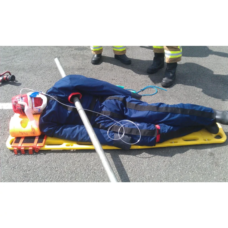 A Ruth Lee™ Multi Trauma Training Manikin showing realistic impalement wounds secured on a stretcher during a simulated rescue and advanced trauma response training exercise.