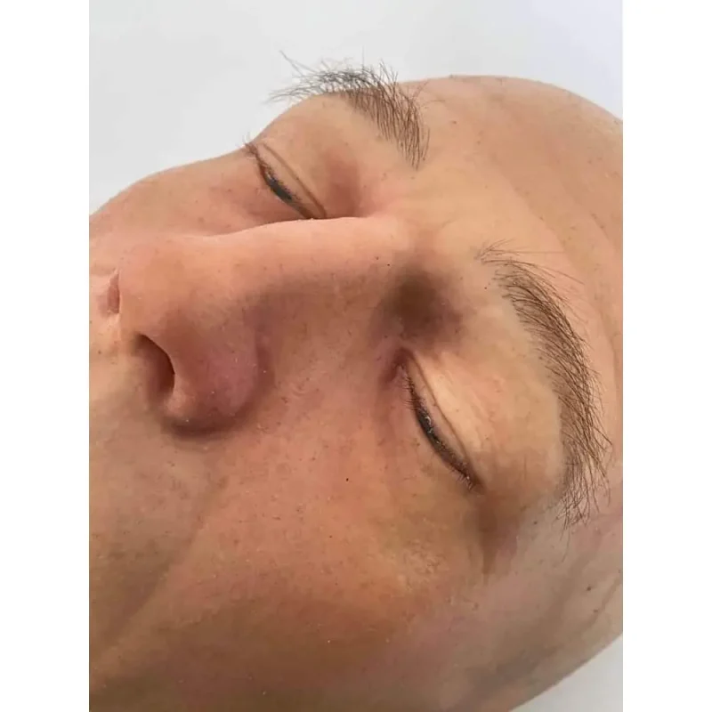 Close-up of the eyes and nose of a Ruth Lee™ Advanced Water Rescue Manikin, featuring detailed facial anatomy for lifelike rescue training.