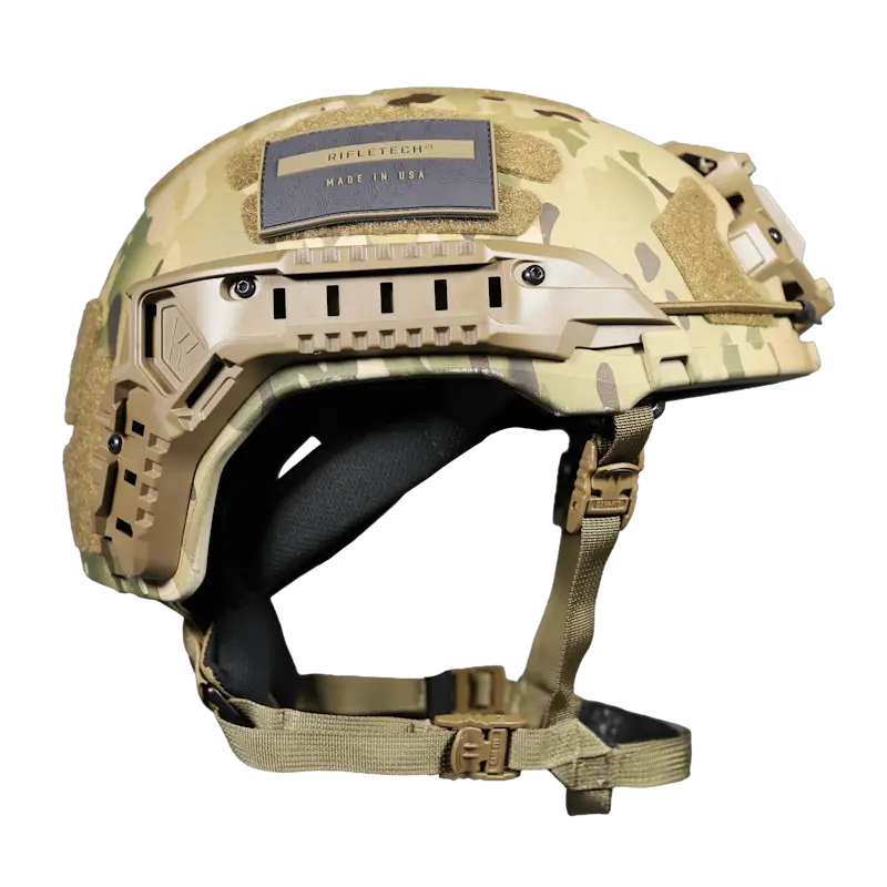 Side profile view of the Team Wendy® RIFLETECH™ Helmet in MultiCam® camouflage showcasing its lightweight tactical shell, rail system, and adjustable retention strap for military and law enforcement operations.